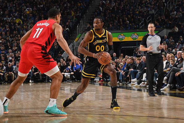 SAN FRANCISCO, CA - DECEMBER 23: Jonathan Kuminga #00 of the Golden State Warriors handles the ball during the game against the Portland Trail Blazers on December 23, 2023 at Chase Center in San Francisco, California. NOTE TO USER: User expressly acknowledges and agrees that, by downloading and or using this photograph, user is consenting to the terms and conditions of Getty Images License Agreement. Mandatory Copyright Notice: Copyright 2023 NBAE (Photo by Noah Graham/NBAE via Getty Images)