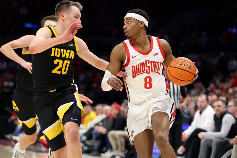 Jan 27, 2025; Columbus, Ohio, USA;  Ohio State Buckeyes guard Micah Parrish (8) dribbles against Iowa Hawkeyes forward Payton Sandfort (20) during the second half at Value City Arena. Mandatory Credit: Joseph Maiorana-Imagn Images