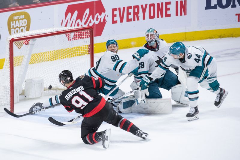 Jan 13, 2024; Ottawa, Ontario, CAN; Ottawa Senators right wing Vladimir Tarasenko (91) scores the game winning goal against San Jose Sharks goalie Mackenzie Blackwood (29) in the third period at the Canadian Tire Centre. Mandatory Credit: Marc DesRosiers-USA TODAY Sports