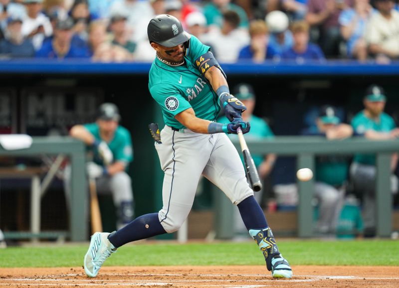 Jun 7, 2024; Kansas City, Missouri, USA; Seattle Mariners center fielder Julio Rodriguez (44) hits a single during the first inning against the Kansas City Royals at Kauffman Stadium. Mandatory Credit: Jay Biggerstaff-USA TODAY Sports