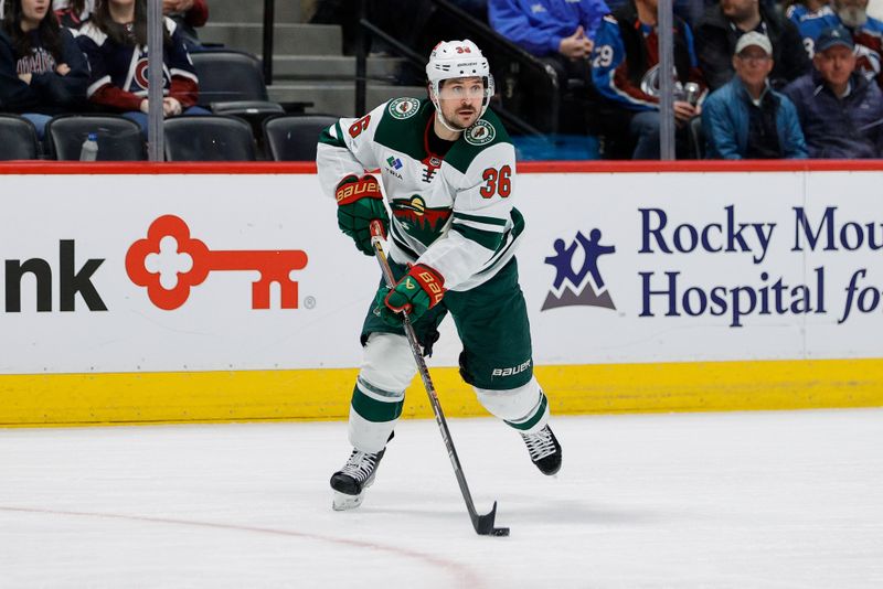 Apr 9, 2024; Denver, Colorado, USA; Minnesota Wild right wing Mats Zuccarello (36) controls the puck in the first period against the Colorado Avalanche at Ball Arena. Mandatory Credit: Isaiah J. Downing-USA TODAY Sports