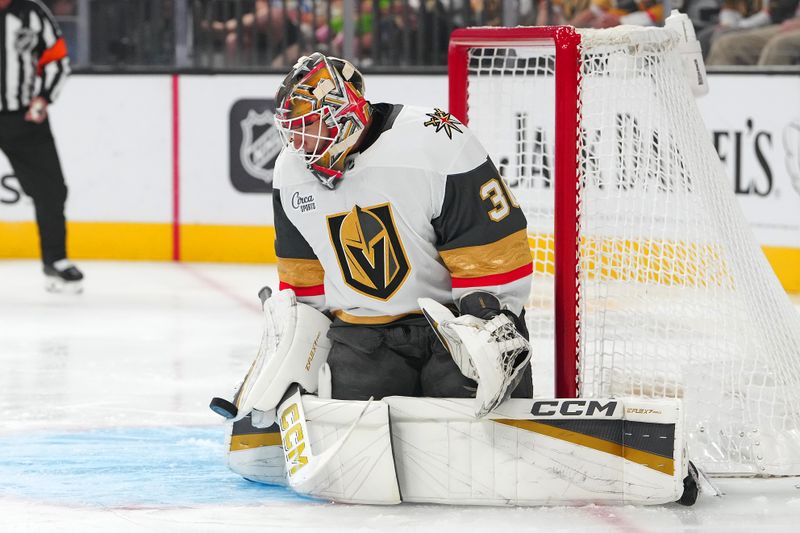 Oct 31, 2025; Las Vegas, Nevada, USA; Vegas Golden Knights goaltender Carl Lindbom (30) makes a save against the Colorado Avalanche during the first period at T-Mobile Arena. Mandatory Credit: Stephen R. Sylvanie-Imagn Images