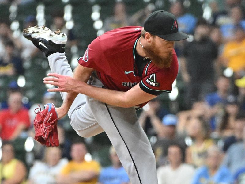 Sep 20, 2024; Milwaukee, Wisconsin, USA; Arizona Diamondbacks pitcher A.J. Puk (33) delivers a pitch against the Milwaukee Brewers in the ninth inning at American Family Field. Mandatory Credit: Michael McLoone-Imagn Images