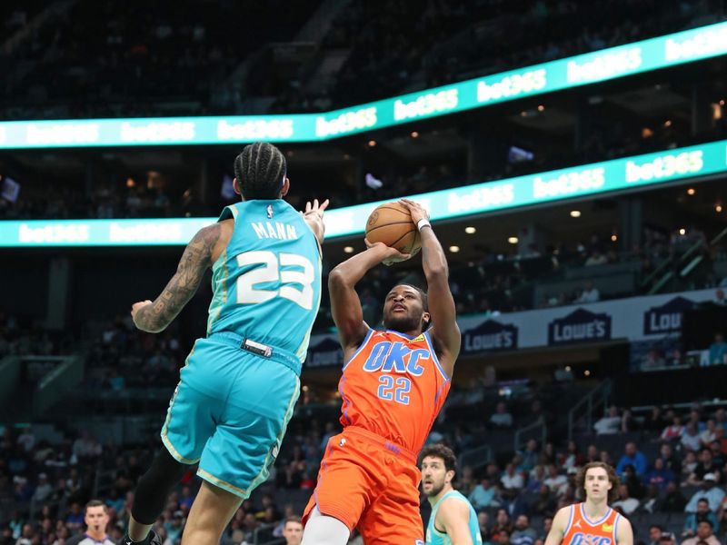 CHARLOTTE, NC - APRIL 7: Cason Wallace #22 of the Oklahoma City Thunder  shoots the ball during the game against the Charlotte Hornets on April 7, 2024 at Spectrum Center in Charlotte, North Carolina. NOTE TO USER: User expressly acknowledges and agrees that, by downloading and or using this photograph, User is consenting to the terms and conditions of the Getty Images License Agreement.  Mandatory Copyright Notice:  Copyright 2024 NBAE (Photo by Brock Williams-Smith/NBAE via Getty Images)