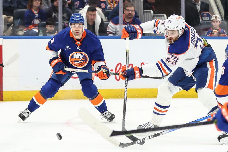 Oct 16, 2025; Elmont, New York, USA; Edmonton Oilers center Leon Draisaitl (29) attempts a shot on goal in the first period against the New York Islanders at UBS Arena. Mandatory Credit: Wendell Cruz-Imagn Images