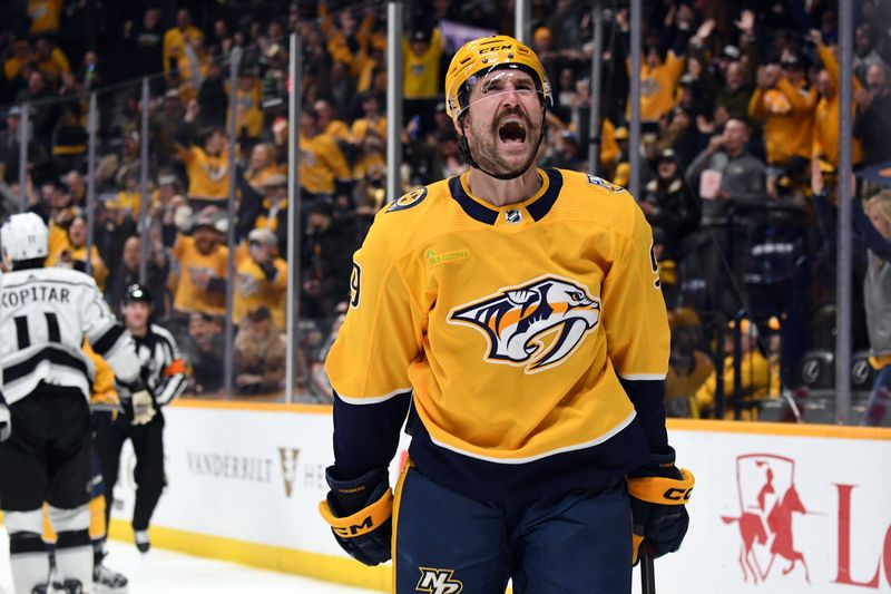 Jan 31, 2024; Nashville, Tennessee, USA; Nashville Predators left wing Filip Forsberg (9) celebrates after a goal during the third period against the Los Angeles Kings at Bridgestone Arena. Mandatory Credit: Christopher Hanewinckel-USA TODAY Sports