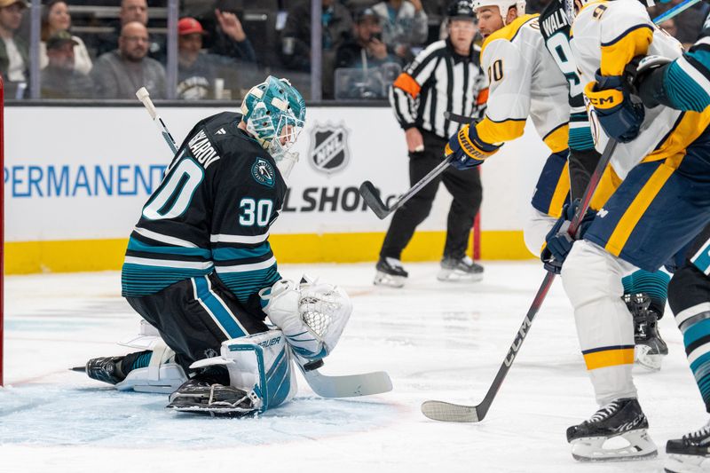 Jan 23, 2025; San Jose, California, USA;  San Jose Sharks goaltender Yaroslav Askarov (30) makes a save against Nashville Predators during the first period at SAP Center at San Jose. Mandatory Credit: Neville E. Guard-Imagn Images