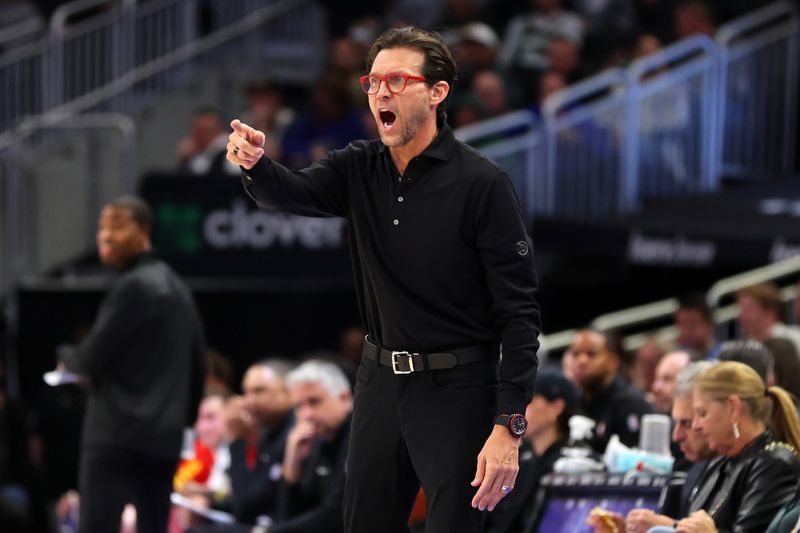 MILWAUKEE, WISCONSIN - DECEMBER 02: Head coach Quin Snyder of the Atlanta Hawks reacts to an officials call during the first half of a game against the Milwaukee Bucks at Fiserv Forum on December 02, 2023 in Milwaukee, Wisconsin. NOTE TO USER: User expressly acknowledges and agrees that, by downloading and or using this photograph, User is consenting to the terms and conditions of the Getty Images License Agreement. (Photo by Stacy Revere/Getty Images)