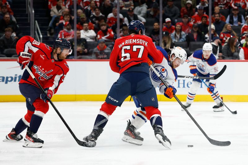 Nov 19, 2025; Washington, District of Columbia, USA; Washington Capitals defenseman Trevor van Riemsdyk (57) checks Edmonton Oilers left wing Andrew Mangiapane (88) during the second period at Capital One Arena. Mandatory Credit: Geoff Burke-Imagn Images