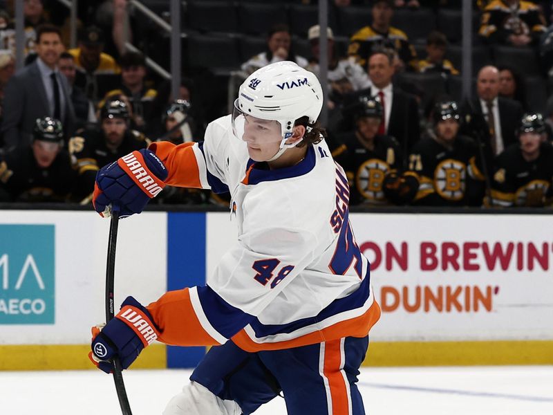 Oct 28, 2025; Boston, Massachusetts, USA; New York Islanders defenseman Matthew Schaefer (48) lets go with a shot during the third period against the Boston Bruins at TD Garden. Mandatory Credit: Winslow Townson-Imagn Images