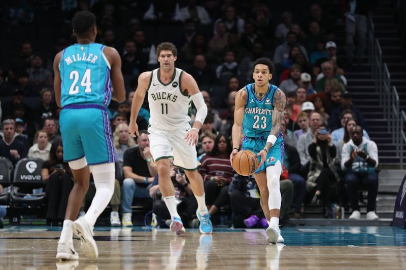 CHARLOTTE, NC - FEBRUARY 29: Tre Mann #23 of the Charlotte Hornets passes the ball during the game against the Milwaukee Bucks on February 29, 2024 at Spectrum Center in Charlotte, North Carolina. NOTE TO USER: User expressly acknowledges and agrees that, by downloading and or using this photograph, User is consenting to the terms and conditions of the Getty Images License Agreement.  Mandatory Copyright Notice:  Copyright 2024 NBAE (Photo by Brock Williams-Smith/NBAE via Getty Images)