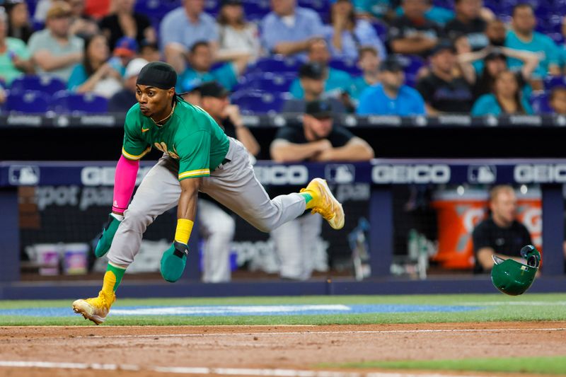 Jun 4, 2023; Miami, Florida, USA; Oakland Athletics center fielder Esteury Ruiz (1) scores on a RBI double by right fielder Ramon Laureano (not pictured) against the Miami Marlins during the third inning  at loanDepot Park. Mandatory Credit: Sam Navarro-USA TODAY Sports