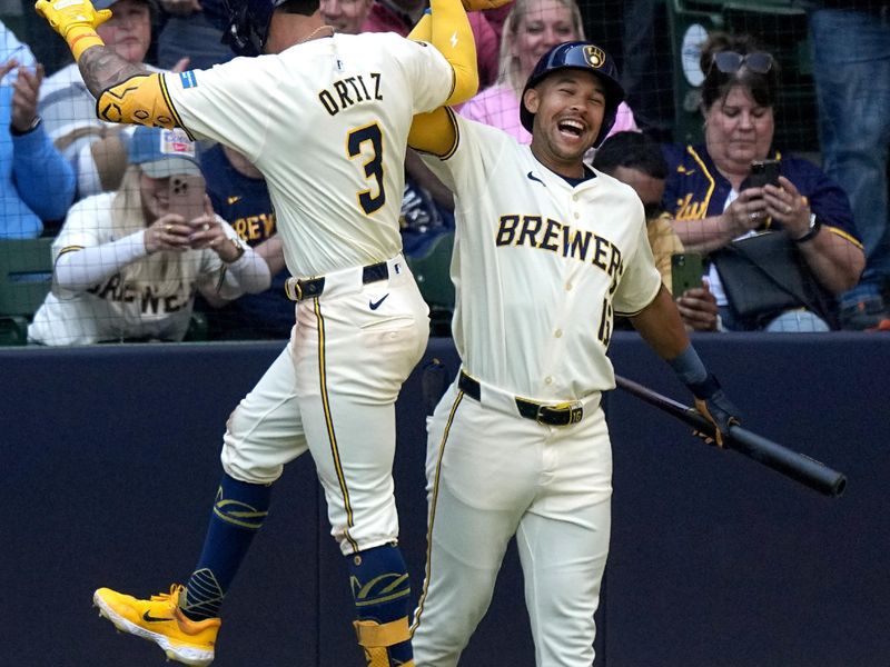 May 15, 2024; Milwaukee, Wisconsin, USA; Milwaukee Brewers third base Joey Ortiz (3) celebrates his solo home run with outfielder Blake Perkins (16) during the fifth inning of their game against the Pittsburgh Pirates at American Family Field. Mandatory Credit: Mark Hoffman-USA TODAY Sports