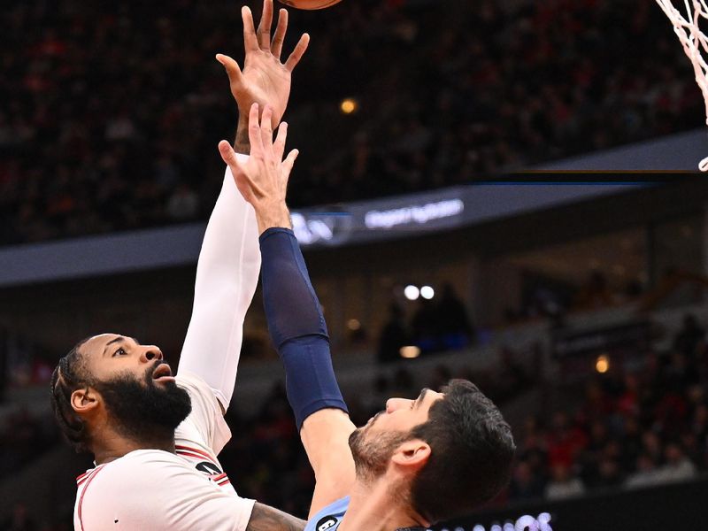 CHICAGO, ILLINOIS - APRIL 02:  Andre Drummond #3 of the Chicago Bulls shoots over Santi Aldama #7 of the Memphis Grizzlies in the first half on April 02, 2023 at United Center in Chicago, Illinois.   NOTE TO USER: User expressly acknowledges and agrees that, by downloading and or using this photograph, User is consenting to the terms and conditions of the Getty Images License Agreement.  (Photo by Jamie Sabau/Getty Images)