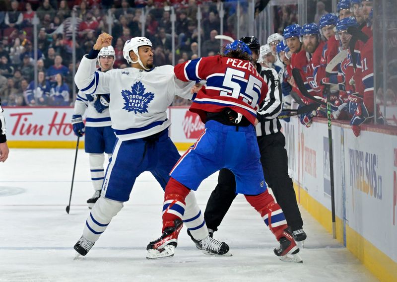 Apr 6, 2024; Montreal, Quebec, CAN; Toronto Maple Leafs forward Ryan Reaves (75) fights Montreal Canadiens forward Michael Pezzetta (55) during the second period at the Bell Centre. Mandatory Credit: Eric Bolte-USA TODAY Sports