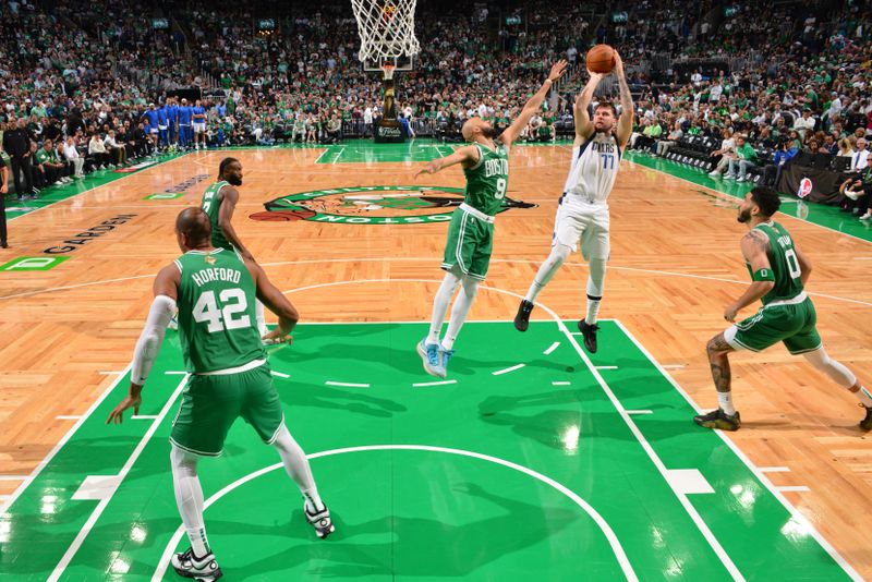 BOSTON, MA - JUNE 17: Luka Doncic #77 of the Dallas Mavericks shoots the ball during the game against the Boston Celtics during Game 5 of the 2024 NBA Finals on June 17, 2024 at the TD Garden in Boston, Massachusetts. NOTE TO USER: User expressly acknowledges and agrees that, by downloading and or using this photograph, User is consenting to the terms and conditions of the Getty Images License Agreement. Mandatory Copyright Notice: Copyright 2024 NBAE  (Photo by Jesse D. Garrabrant/NBAE via Getty Images)