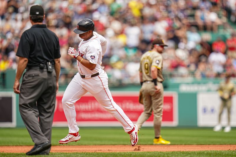 Jun 30, 2024; Boston, Massachusetts, USA; Boston Red Sox third baseman Rafael Devers (11) hits a two run home run against the San Diego Padres in the first inning at Fenway Park. Mandatory Credit: David Butler II-USA TODAY Sports