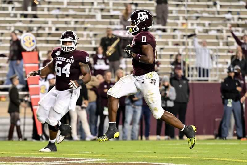 Nov 11, 2023; College Station, Texas, USA; Texas A&M Aggies wide receiver Ainias Smith (0) runs the ball into the end zone for a touchdown during the second quarter against the Mississippi State Bulldogs at Kyle Field. Mandatory Credit: Maria Lysaker-USA TODAY Sports