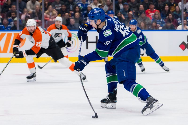 Dec 28, 2023; Vancouver, British Columbia, CAN; Vancouver Canucks forward Ilya Mikheyev (65) shoots against the Philadelphia Flyers in the third period at Rogers Arena. Flyers won 4-1. Mandatory Credit: Bob Frid-USA TODAY Sports