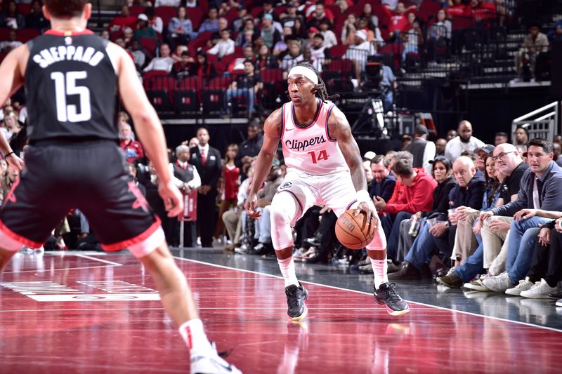 HOUSTON, TX - NOVEMBER 15: Terance Mann #14 of the LA Clippers dribbles the ball during the game against the Houston Rockets during the Emirates NBA Cup game on November 15, 2024 at the Toyota Center in Houston, Texas. NOTE TO USER: User expressly acknowledges and agrees that, by downloading and or using this photograph, User is consenting to the terms and conditions of the Getty Images License Agreement. Mandatory Copyright Notice: Copyright 2024 NBAE (Photo by Logan Riely/NBAE via Getty Images)