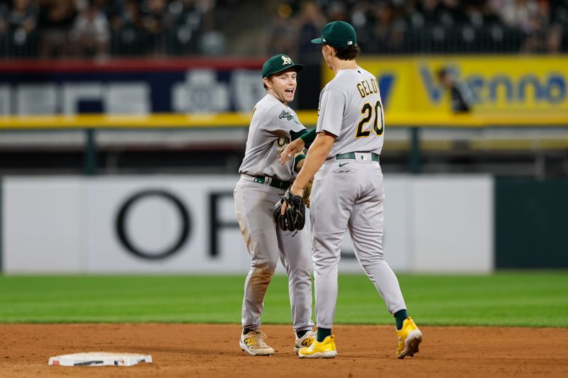 Aug 25, 2023; Chicago, Illinois, USA; Oakland Athletics shortstop Nick Allen (2) celebrates with second baseman Zack Gelof (20) after defeating the Chicago White Sox 12-4 at Guaranteed Rate Field. Mandatory Credit: Kamil Krzaczynski-USA TODAY Sports