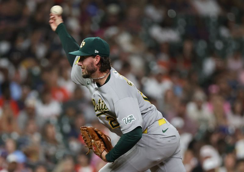 May 27, 2025; Houston, Texas, USA; Athletics relief pitcher Mitch Spence (28) pitches against the Houston Astros in the fifth inning at Daikin Park. Mandatory Credit: Thomas Shea-Imagn Images