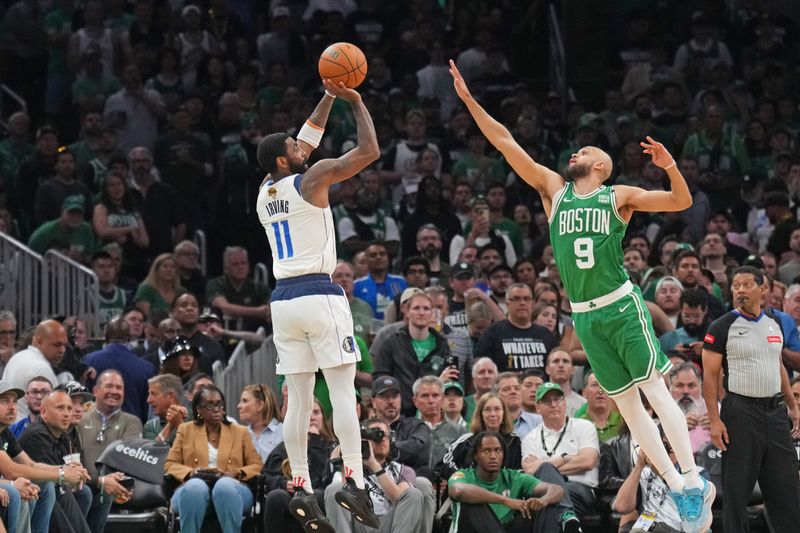 BOSTON, MA - JUNE 17: Kyrie Irving #11 of the Dallas Mavericks shoots a three point basket during the game  against the Boston Celticsduring Game 5 of the 2024 NBA Finals on June 17, 2024 at the TD Garden in Boston, Massachusetts. NOTE TO USER: User expressly acknowledges and agrees that, by downloading and or using this photograph, User is consenting to the terms and conditions of the Getty Images License Agreement. Mandatory Copyright Notice: Copyright 2024 NBAE  (Photo by Jesse D. Garrabrant/NBAE via Getty Images)