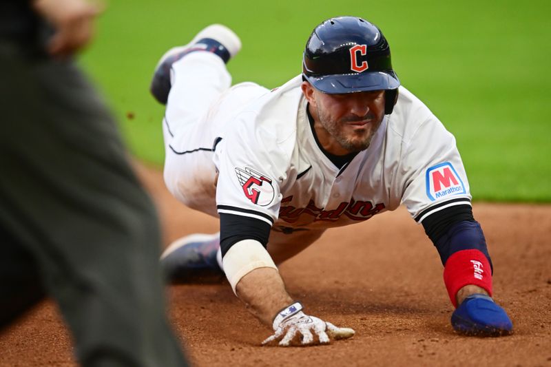 Apr 9, 2024; Cleveland, Ohio, USA; Cleveland Guardians right fielder Ramon Laureano (10) steals third base during the fourth inning against the Chicago White Sox at Progressive Field. Mandatory Credit: Ken Blaze-USA TODAY Sports