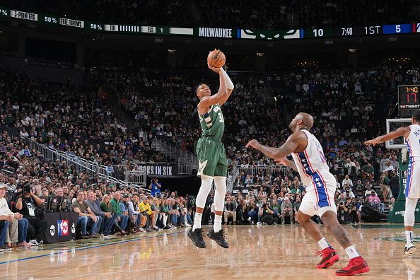 MILWAUKEE, WI - OCTOBER 26: Giannis Antetokounmpo #34 of the Milwaukee Bucks shoots a three point basket against the Philadelphia 76ers on October 26, 2023 at the Fiserv Forum Center in Milwaukee, Wisconsin. NOTE TO USER: User expressly acknowledges and agrees that, by downloading and or using this Photograph, user is consenting to the terms and conditions of the Getty Images License Agreement. Mandatory Copyright Notice: Copyright 2023 NBAE (Photo by Jesse D. Garrabrant/NBAE via Getty Images).