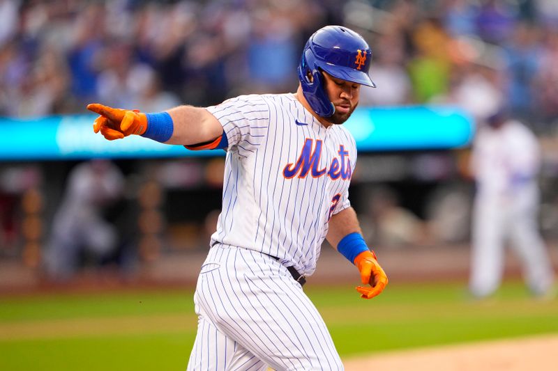 Aug 30, 2023; New York City, New York, USA;  New York Mets right fielder DJ Steward (29) points to his teammates in the dugout as he rounds the bases after hitting a home run against the Texas Rangers during the second inning at Citi Field. Mandatory Credit: Gregory Fisher-USA TODAY Sports