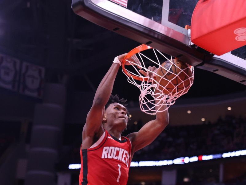 HOUSTON, TX - NOVEMBER 4: Amen Thompson #1 of the Houston Rockets dunks the ball during the game against the New York Knicks on November 4, 2024 at the Toyota Center in Houston, Texas. NOTE TO USER: User expressly acknowledges and agrees that, by downloading and or using this photograph, User is consenting to the terms and conditions of the Getty Images License Agreement. Mandatory Copyright Notice: Copyright 2024 NBAE (Photo by Michael Starghill Jr./NBAE via Getty Images)