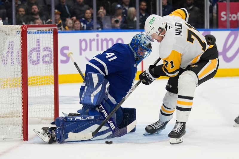 Nov 3, 2025; Toronto, Ontario, CAN; Toronto Maple Leafs goaltender Anthony Stolarz (41) makes a save on a breakaway against Pittsburgh Penguins forward Evgeni Malkin (71) during the second period at Scotiabank Arena. Mandatory Credit: John E. Sokolowski-Imagn Images