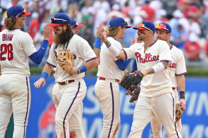 Jun 11, 2023; Philadelphia, Pennsylvania, USA; Philadelphia Phillies center fielder Brandon Marsh (16) and right fielder Nick Castellanos (8) celebrates win with teammates against the Los Angeles Dodgers  at Citizens Bank Park. Mandatory Credit: Eric Hartline-USA TODAY Sports