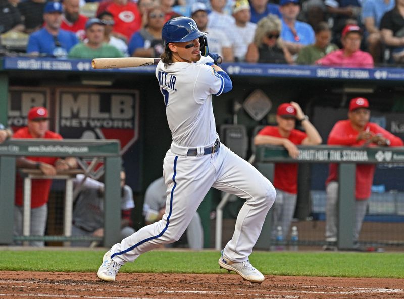 Jun 14, 2023; Kansas City, Missouri, USA;  Kansas City Royals shortstop Bobby Witt Jr. (7) hits an RBI double in the third inning against the Cincinnati Reds at Kauffman Stadium. Mandatory Credit: Peter Aiken-USA TODAY Sports