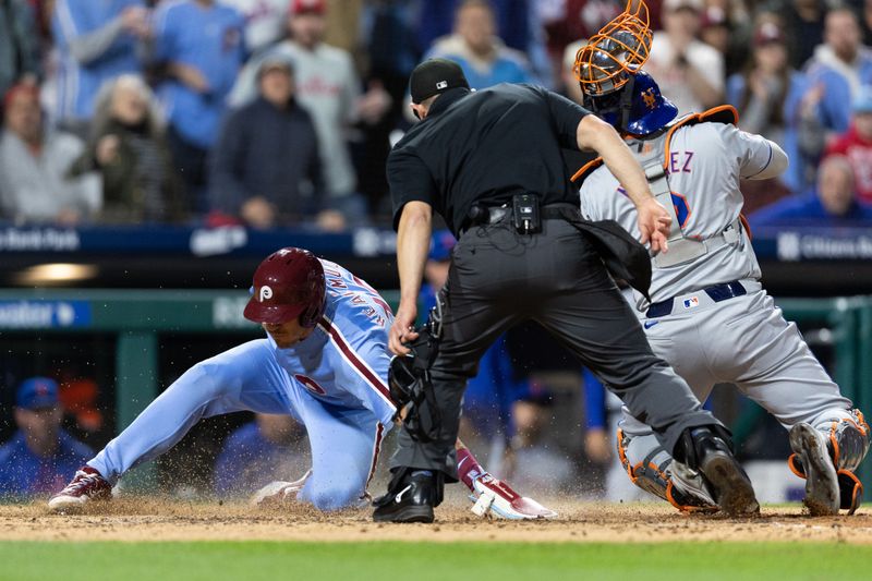 May 16, 2024; Philadelphia, Pennsylvania, USA; Philadelphia Phillies catcher J.T. Realmuto (10) scores past the tag attempt of New York Mets catcher Omar Narváez (2) during the sixth inning at Citizens Bank Park. Mandatory Credit: Bill Streicher-USA TODAY Sports