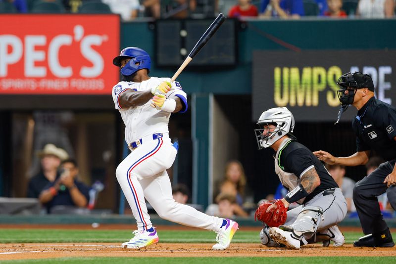 Jul 23, 2024; Arlington, Texas, USA; Texas Rangers outfielder Adolis García (53) singles in a run during the first inning against the Chicago White Sox at Globe Life Field. Mandatory Credit: Andrew Dieb-USA TODAY Sports