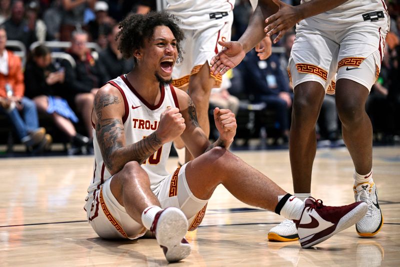 Nov 24, 2023; La Jolla, California, USA; USC Trojans forward DJ Rodman (10) celebrates during the second half against the Oklahoma Sooners at LionTree Arena. Mandatory Credit: Orlando Ramirez-USA TODAY Sports