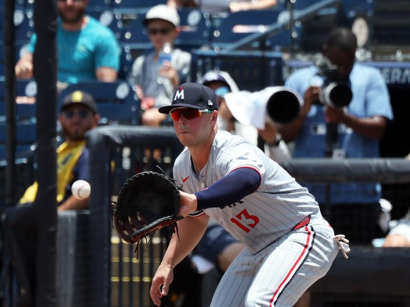May 28, 2025; Minneapolis, Minnesota, USA;  Minnesota Twins first base Ty France (13) catches the ball for an out against the Tampa Bay Rays during the third inning at George M. Steinbrenner Field. Mandatory Credit: Kim Klement Neitzel-Imagn Images
