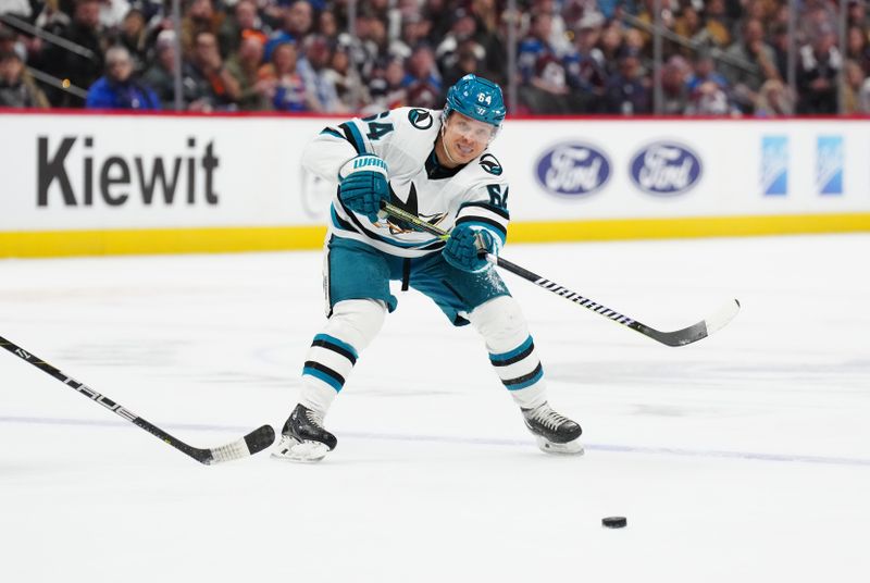 Dec 31, 2023; Denver, Colorado, USA; San Jose Sharks center Mikael Granlund (64) passes the puck in the third period against the Colorado Avalanche at Ball Arena. Mandatory Credit: Ron Chenoy-USA TODAY Sports