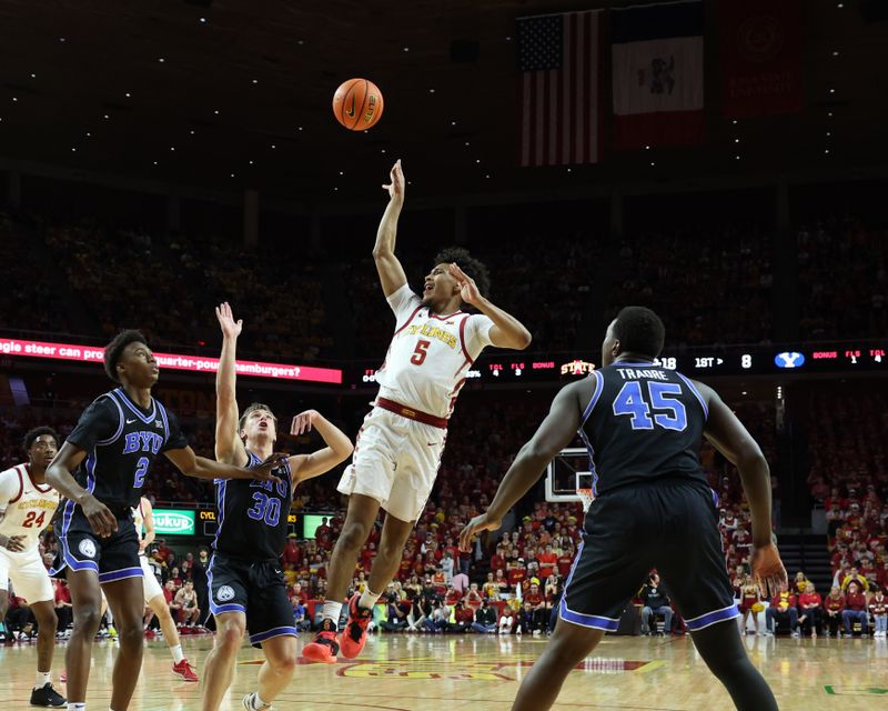 Mar 6, 2024; Ames, Iowa, USA; Iowa State Cyclones guard Curtis Jones (5) shoots over the Brigham Young Cougars defense at James H. Hilton Coliseum. Mandatory Credit: Reese Strickland-USA TODAY Sports

