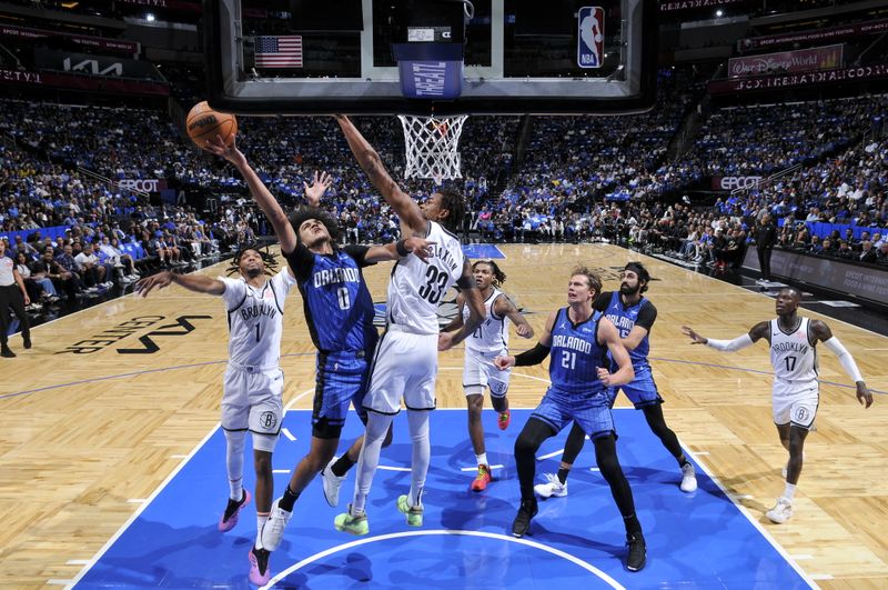 ORLANDO, FL - OCTOBER 25: Anthony Black #0 of the Orlando Magic drives to the basket during the game against the Brooklyn Nets on October 25, 2024 at Kia Center in Orlando, Florida. NOTE TO USER: User expressly acknowledges and agrees that, by downloading and or using this photograph, User is consenting to the terms and conditions of the Getty Images License Agreement. Mandatory Copyright Notice: Copyright 2024 NBAE (Photo by Fernando Medina/NBAE via Getty Images)