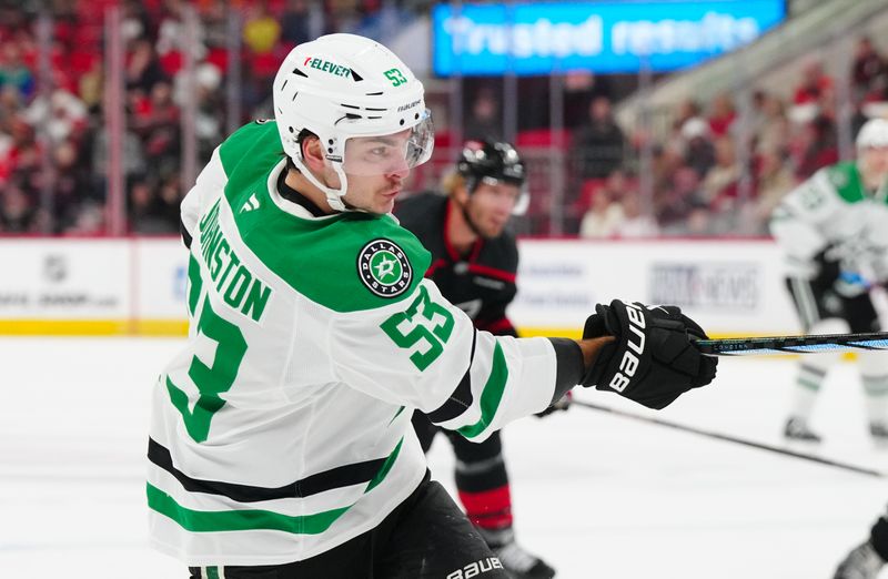 Nov 25, 2024; Raleigh, North Carolina, USA;  Dallas Stars center Wyatt Johnston (53) takes a shot against the Carolina Hurricanes during the second period at Lenovo Center. Mandatory Credit: James Guillory-Imagn Images