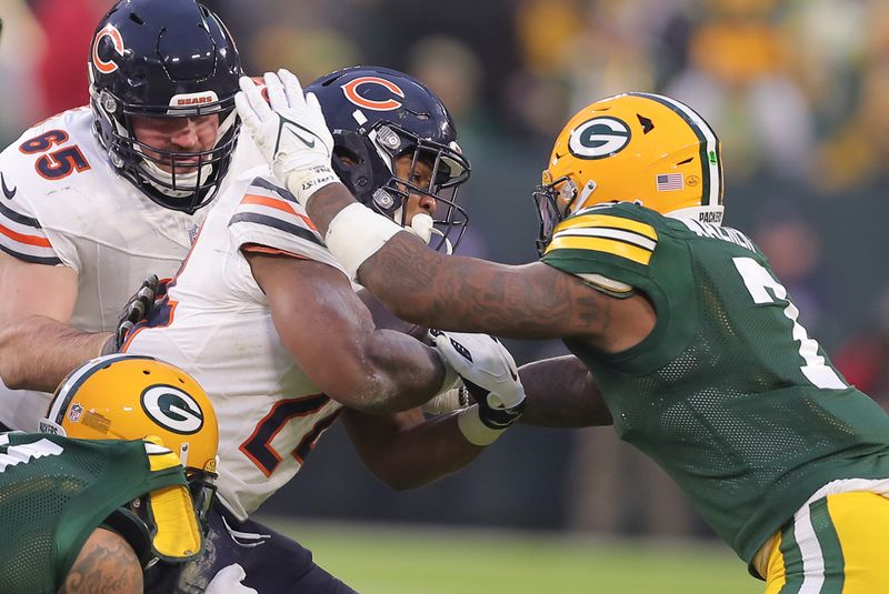 Green Bay Packers linebacker Quay Walker (7) and Chicago Bears running back Khalil Herbert (24) during an NFL football game, Sunday, Jan. 07, 2024, in Green Bay. (AP Photo/Melissa Tamez)