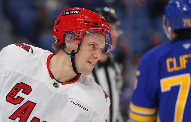 Jan 15, 2025; Buffalo, New York, USA;  Carolina Hurricanes left wing Juha Jaaska (54) during a stoppage in play against the Buffalo Sabres at KeyBank Center. Mandatory Credit: Timothy T. Ludwig-Imagn Images