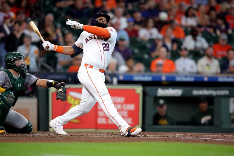 Sep 12, 2024; Houston, Texas, USA; Houston Astros first baseman Jon Singleton (28) hits a double to left field against the Oakland Athletics during the second inning at Minute Maid Park. Mandatory Credit: Erik Williams-Imagn Images