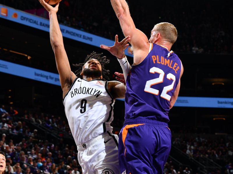 PHOENIX, AZ - NOVEMBER 27: Trendon Watford #9 of the Brooklyn Nets drives to the basket during the game against the Phoenix Suns on November 27, 2024 at Footprint Center in Phoenix, Arizona. NOTE TO USER: User expressly acknowledges and agrees that, by downloading and or using this photograph, user is consenting to the terms and conditions of the Getty Images License Agreement. Mandatory Copyright Notice: Copyright 2024 NBAE (Photo by Barry Gossage/NBAE via Getty Images)