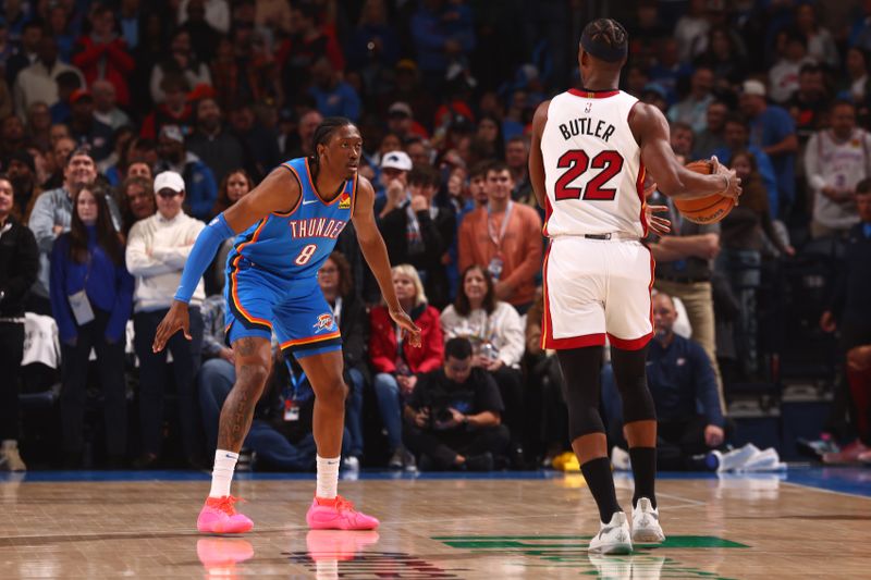 OKLAHOMA CITY, OK - MARCH 8:  Jalen Williams #8 of the Oklahoma City Thunder plays defense against Jimmy Butler #22 of the Miami Heat on March 8, 2024 at Paycom Arena in Oklahoma City, Oklahoma. NOTE TO USER: User expressly acknowledges and agrees that, by downloading and or using this photograph, User is consenting to the terms and conditions of the Getty Images License Agreement. Mandatory Copyright Notice: Copyright 2024 NBAE (Photo by Zach Beeker/NBAE via Getty Images)