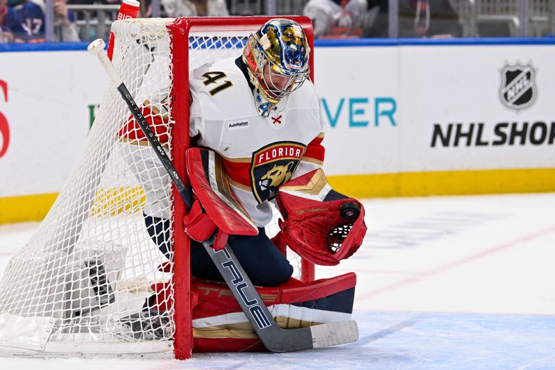 Jan 27, 2024; Elmont, New York, USA; Florida Panthers goaltender Anthony Stolarz (41) makes a glove save against the New York Islanders during the second period at UBS Arena. Mandatory Credit: Dennis Schneidler-USA TODAY Sports