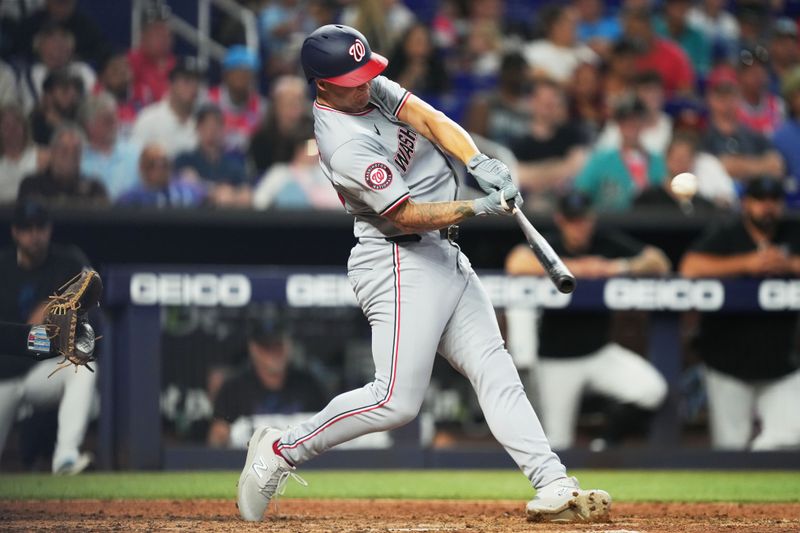 Apr 28, 2024; Miami, Florida, USA;  Washington Nationals designated hitter Nick Senzel (13) hits a three-run home run against the Miami Marlins in the fifth inning at loanDepot Park. Mandatory Credit: Jim Rassol-USA TODAY Sports