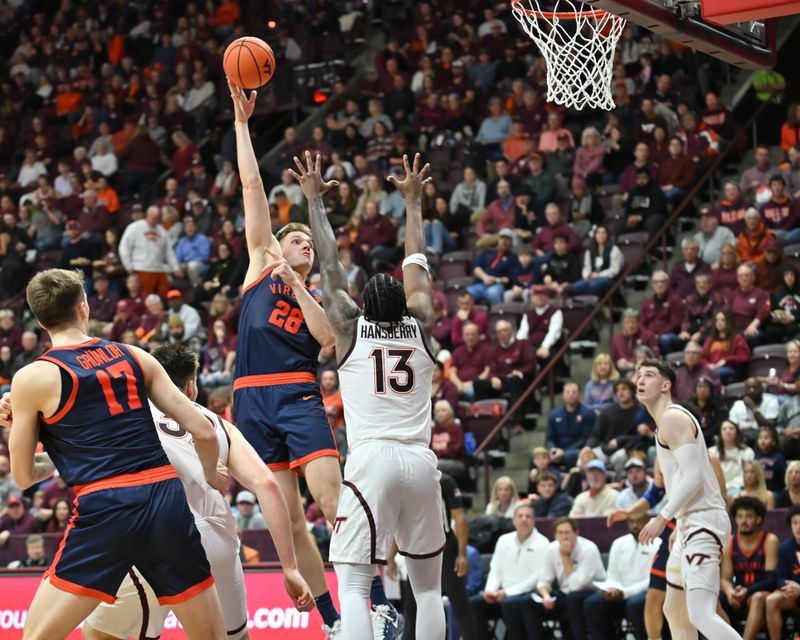 Dec 31, 2025; Blacksburg, Virginia, USA;  Virginia Cavaliers guard Desmond Roberts (13) shoots a shot over Virginia Tech Hokies forward Amani Hansberry (13) at Cassell Coliseum. Mandatory Credit: Brian Bishop-Imagn Images